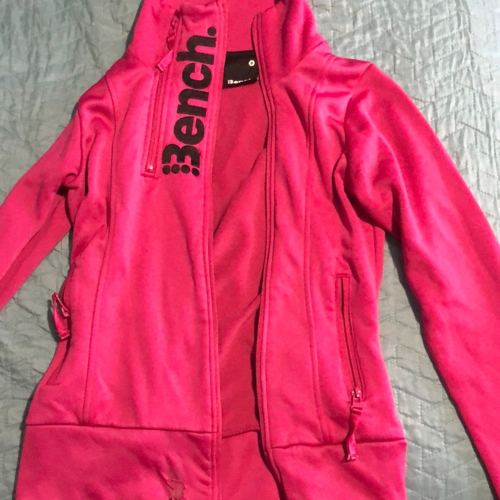 Ladies bench sweater. Does have a rip at the bottom of it, but still wearable